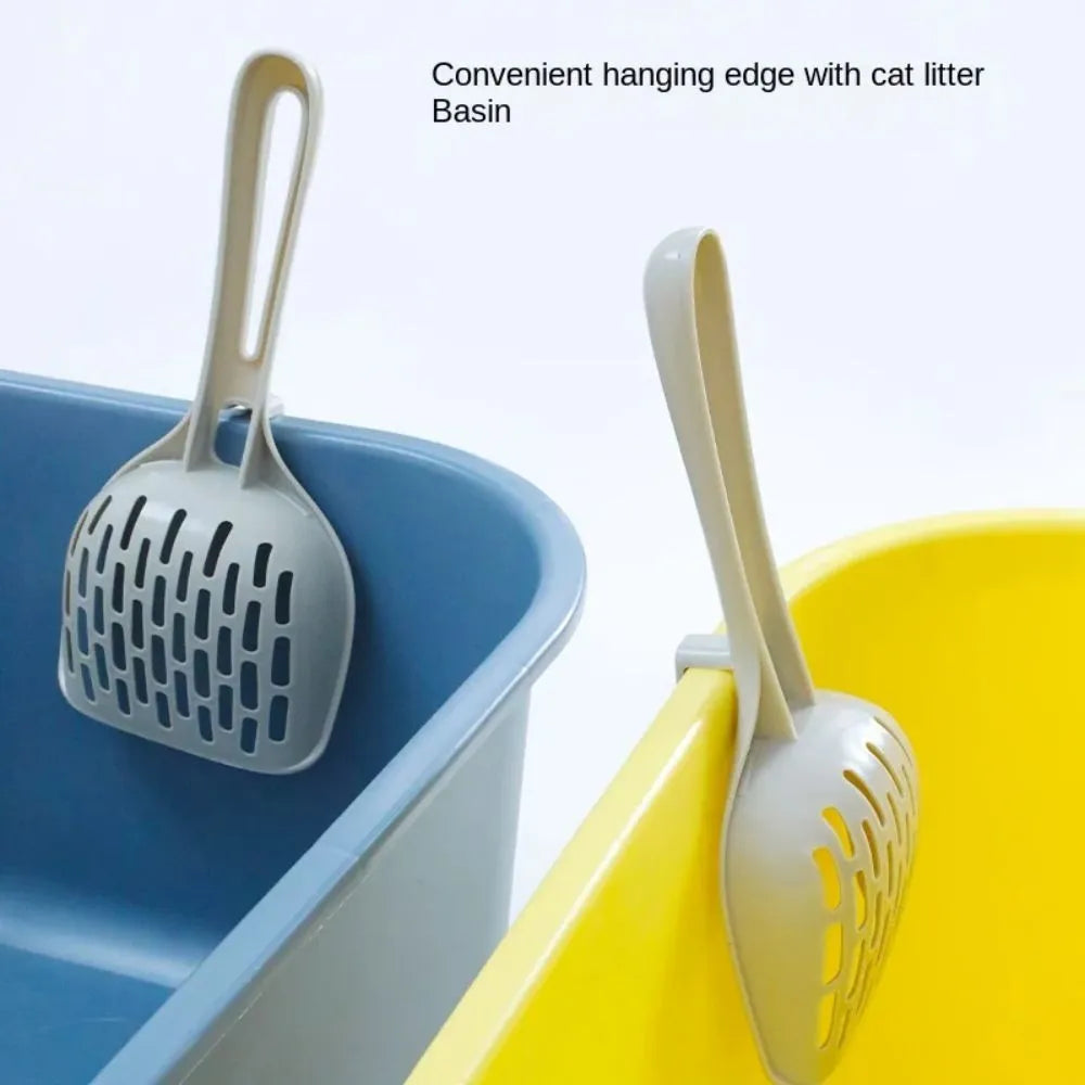Grey plastic cat litter scoop sitting in its matching plastic storage base.