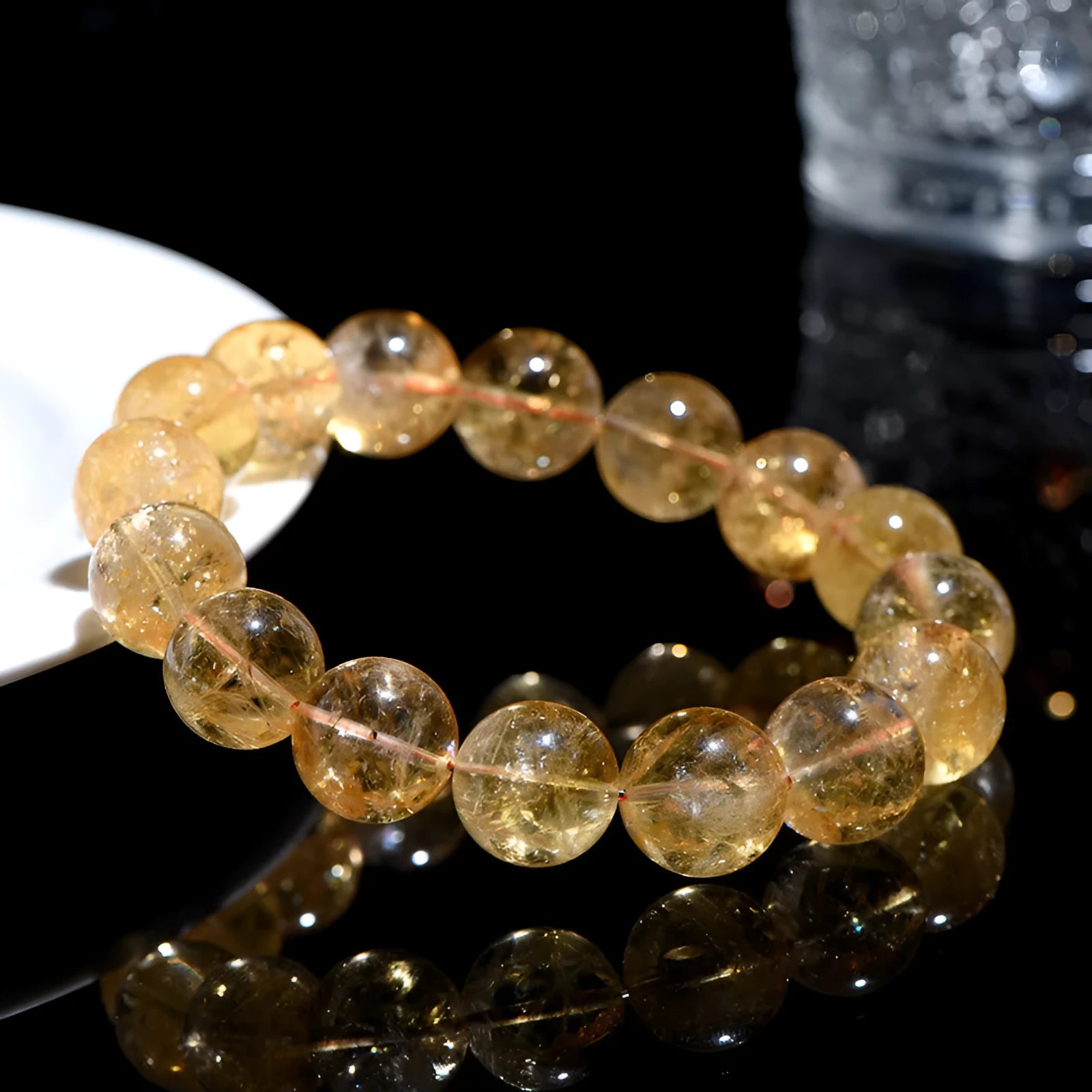 Natural yellow citrine bead bracelet showing options for single strand and triple strand styles.