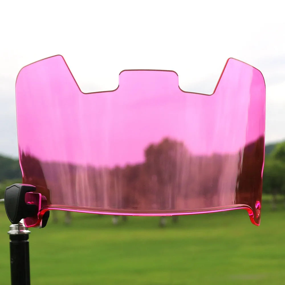 Close-up of multicolour rugby helmet goggles made from impact-resistant material, shown detached from a helmet.