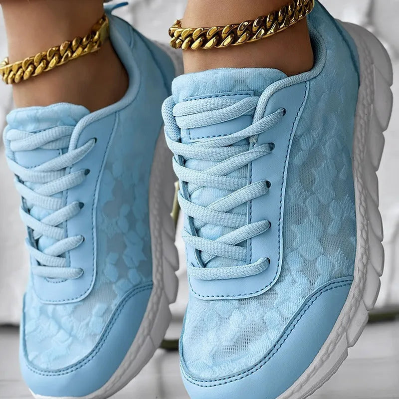 Women's casual canvas running shoes in white with a round toe, flat heel, and soft sole.