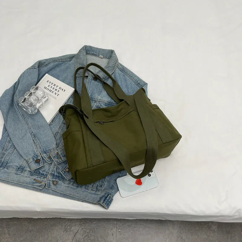 Polyester canvas shoulder bag in solid colour with internal mobile phone pocket organisation