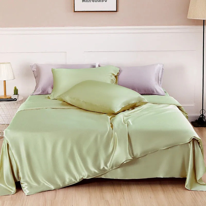 Double-sided solid colour silk duvet cover shown in Lotus Pink, pea green, bright brown, purple, white, or blue.