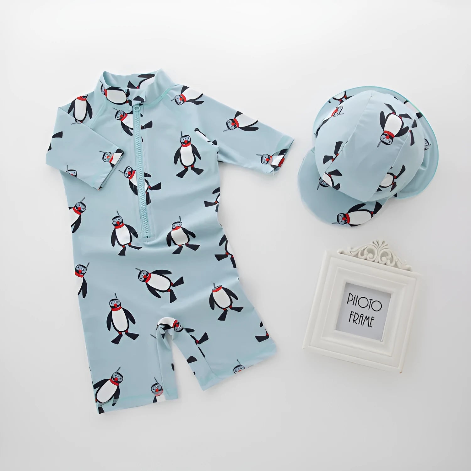 Boys' long sleeve penguin print swimsuit two-piece set with matching swimming cap