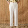 Straight-leg linen trousers in greige colour with a high elasticated waistband on a hanger.