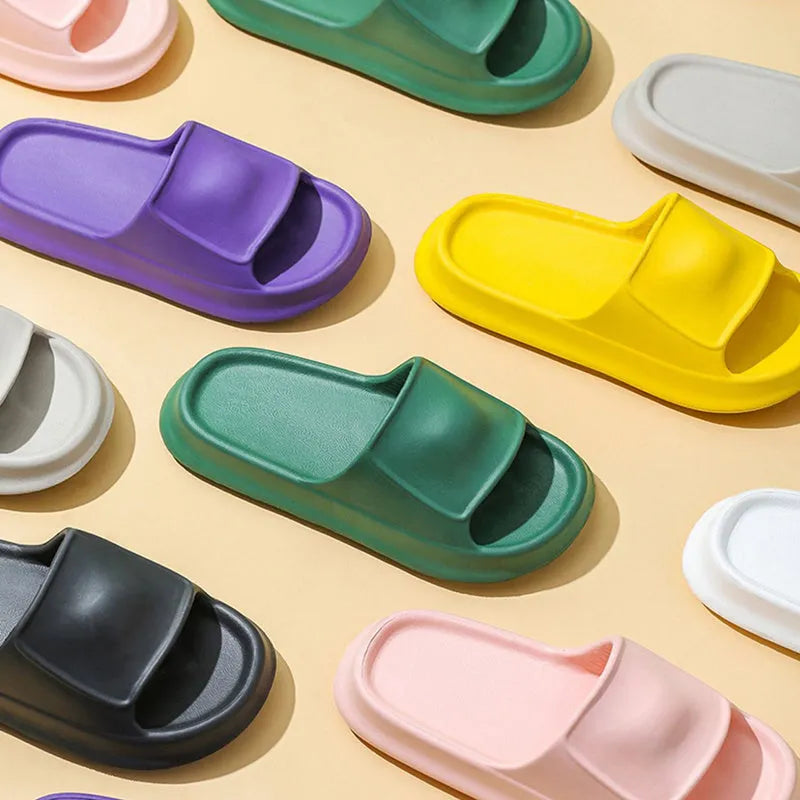 Thick-soled EVA foam flip-flop slippers for men and women in assorted colours on a white background.