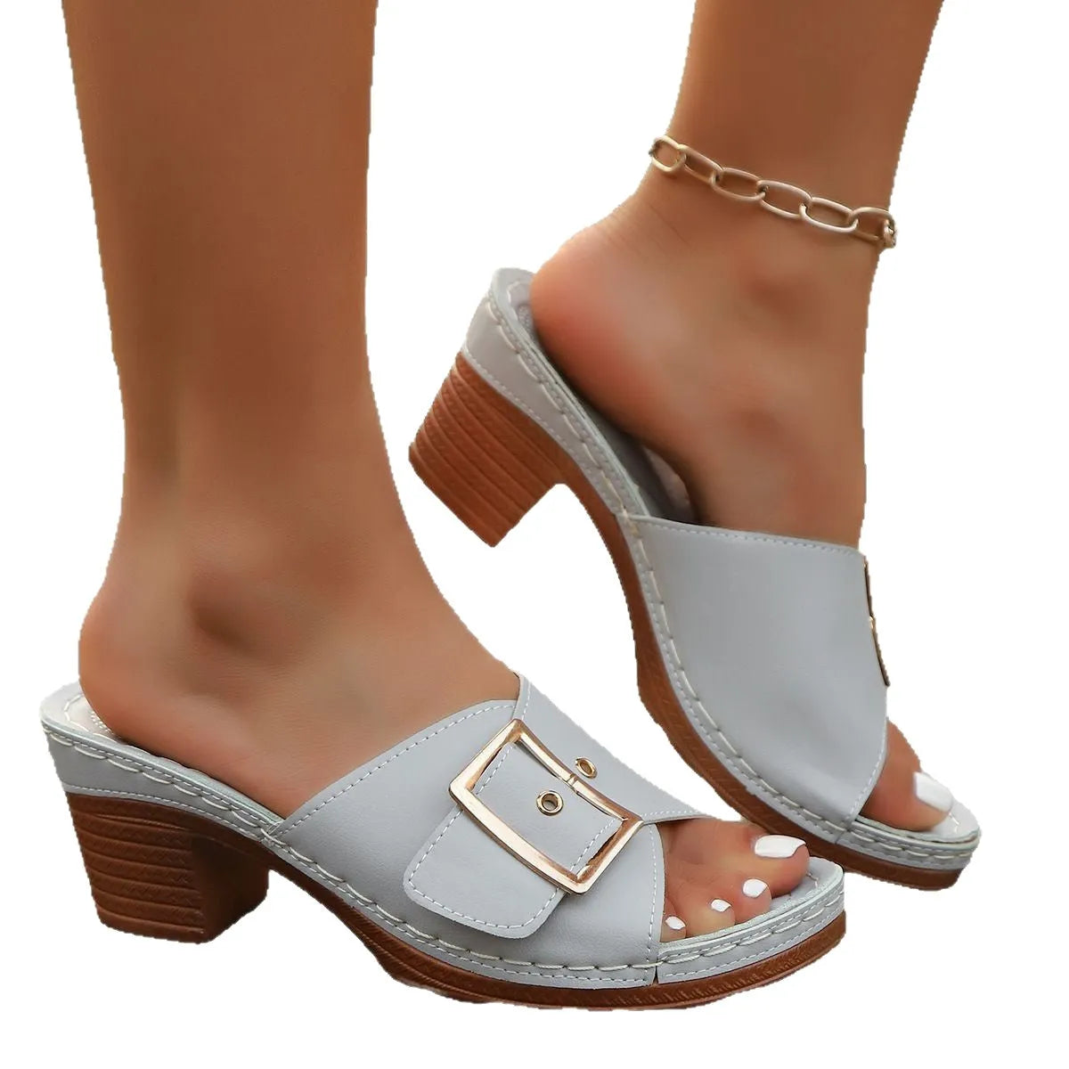 Women's black chunky heel slippers with a silver metal buckle fastening on the strap