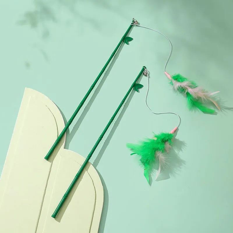 Green interactive cat feather wand with bells and feathers, durable play toy