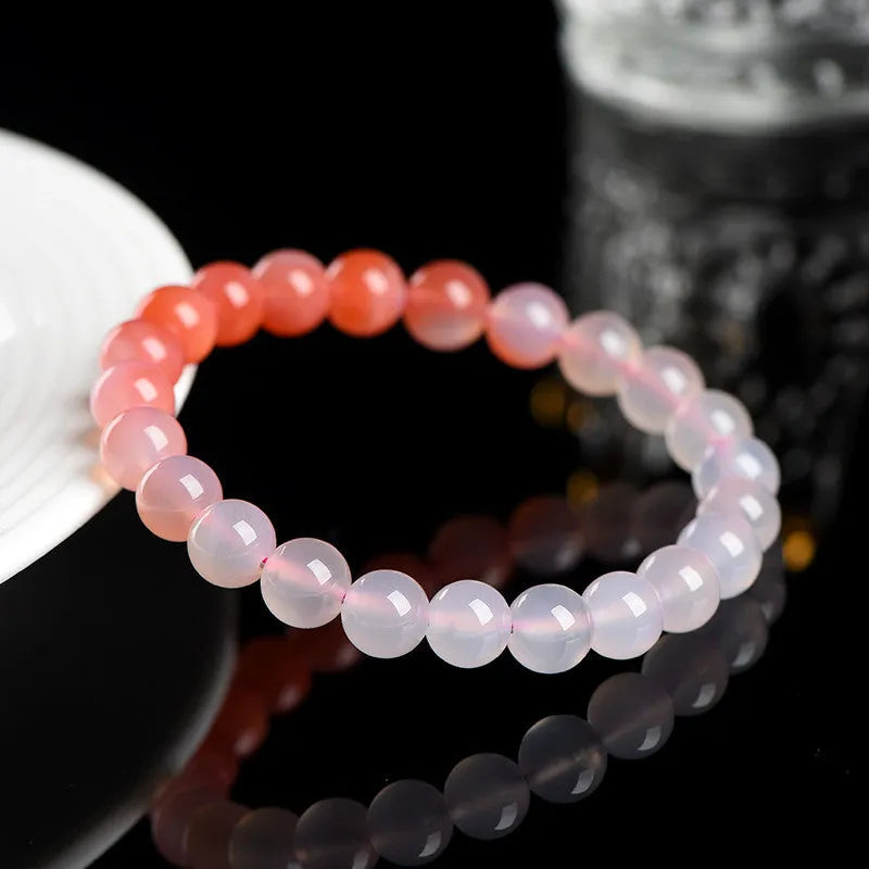 Natural gradient Yanyuan agate bracelet with geometric beads in a salt source colour, shown with size options.