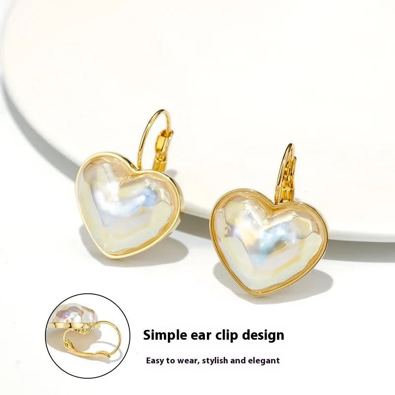 A pair of gold-coloured alloy ear clips for women in a natural style.