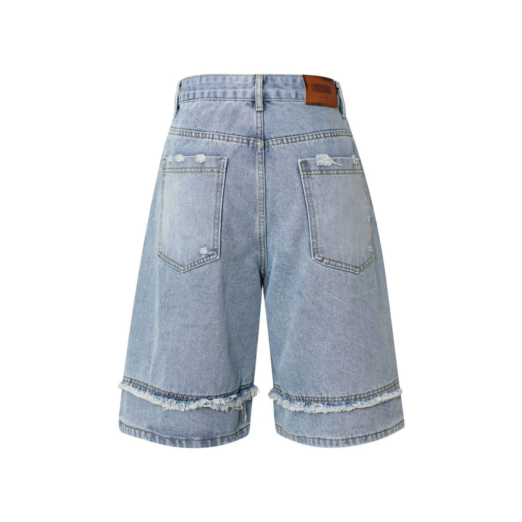 Men's distressed light blue denim shorts with raw-edge hem and straight-leg cut on a neutral background.