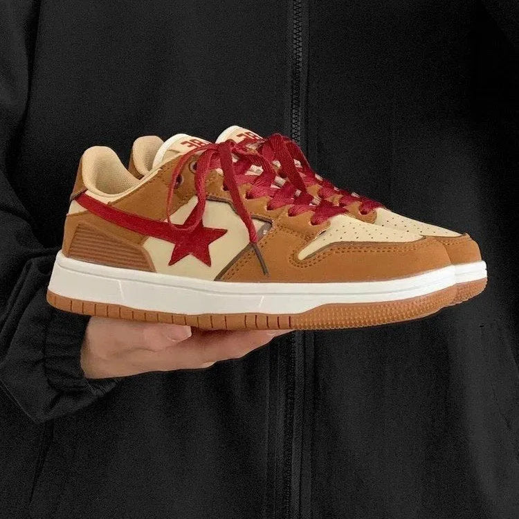 Brown low-top platform sneakers with sequins, lace-up fastening, and rubber sole on light background