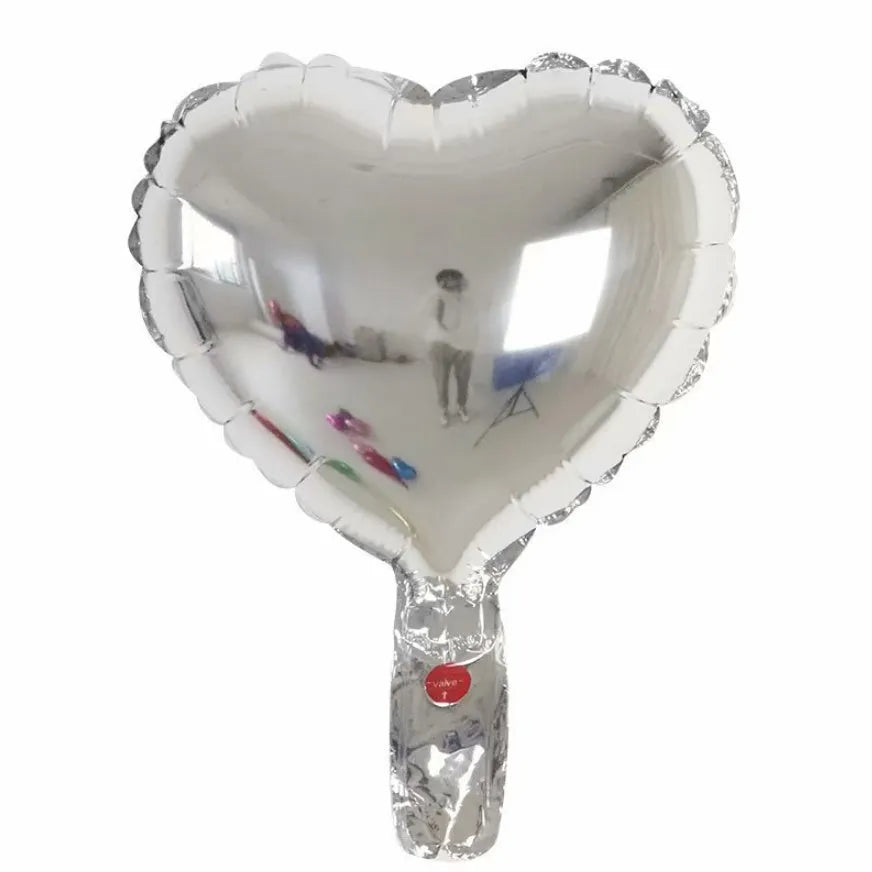 Five peach heart-shaped aluminium foil balloons in metallic colours for party decorations
