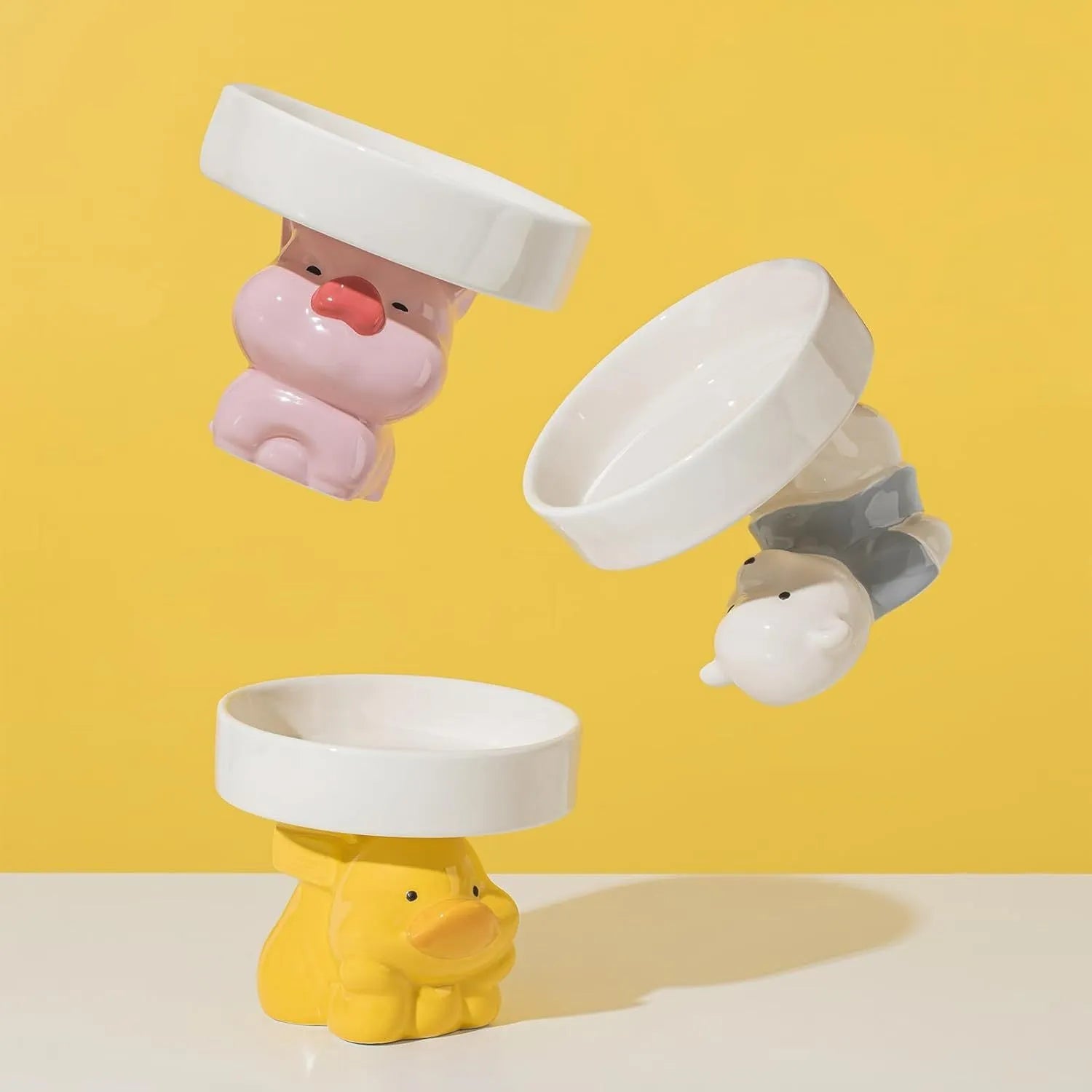 Raised ceramic cat bowl with animal design for elevated feeding