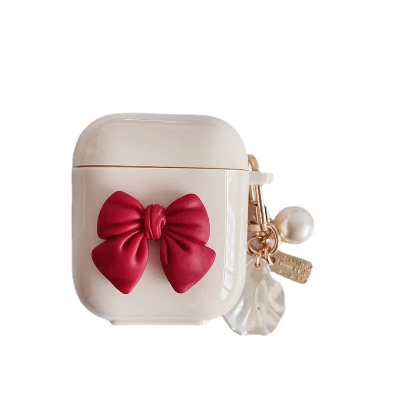 Beige red bow shell patterned TPU protective case for Apple AirPods Pro and AirPods 1, 2, 3 wireless earphones.