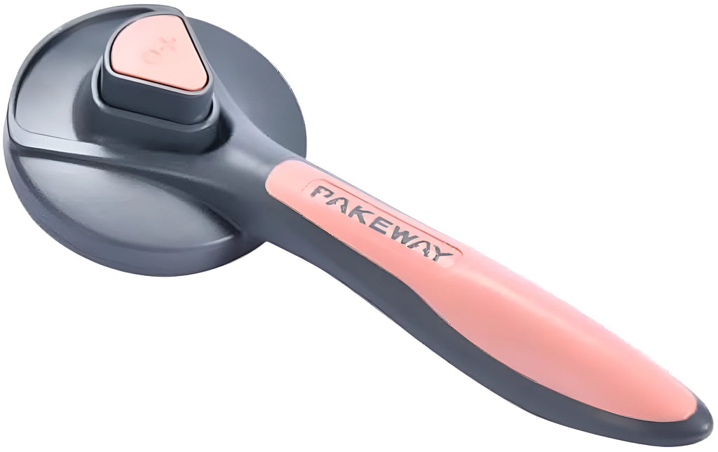 Grey self-cleaning slicker brush for pets with one-click button and comfort-grip handle on a table.
