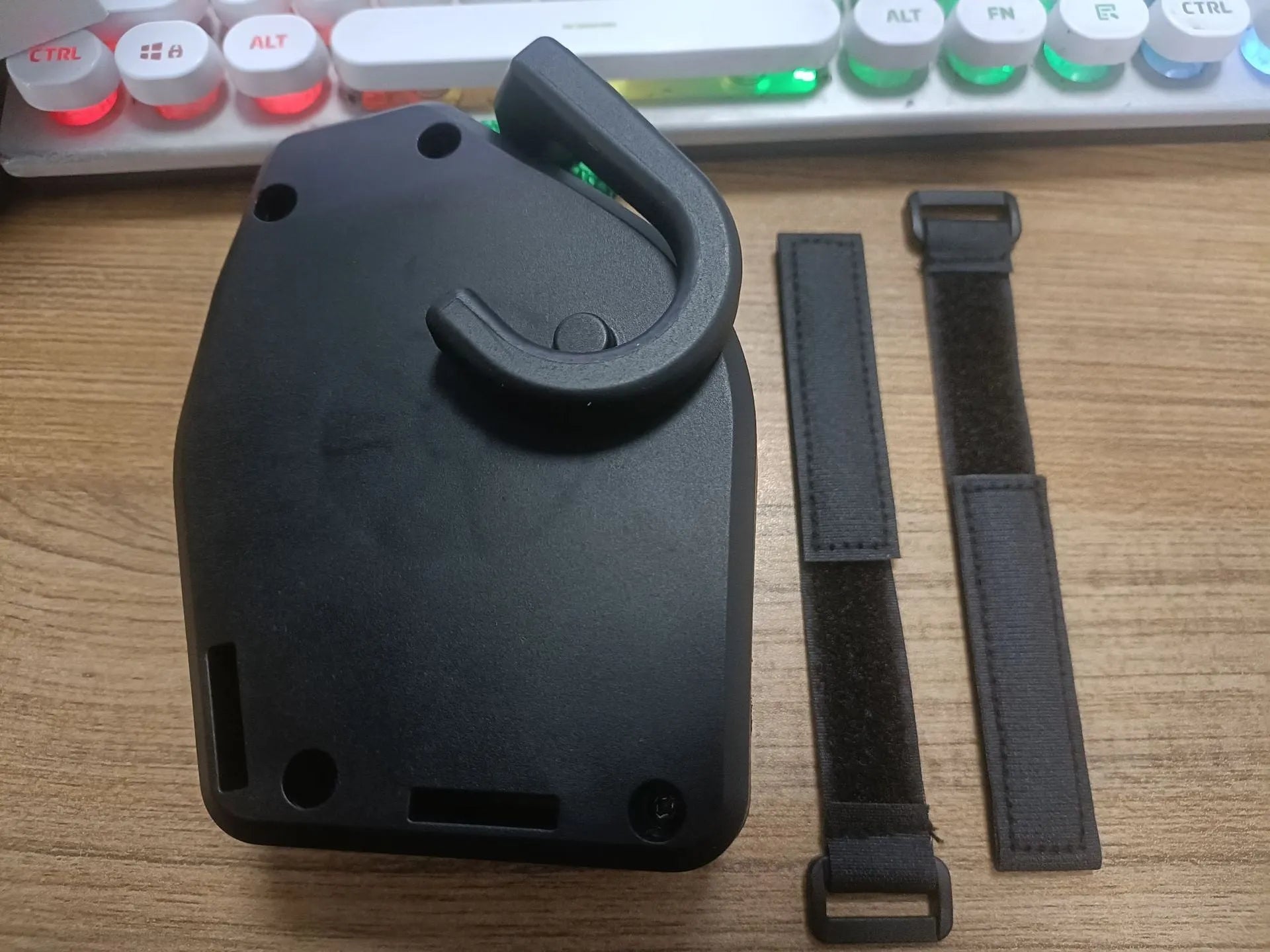 Black plastic and resin bicycle trailer towing rope for mountain bike trailer connection.
