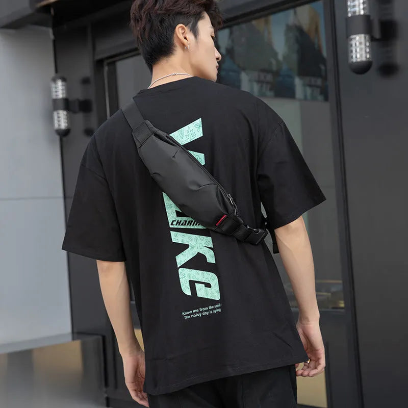 Black Oxford cloth crossbody waist pack showing multiple internal pockets and zipper closure