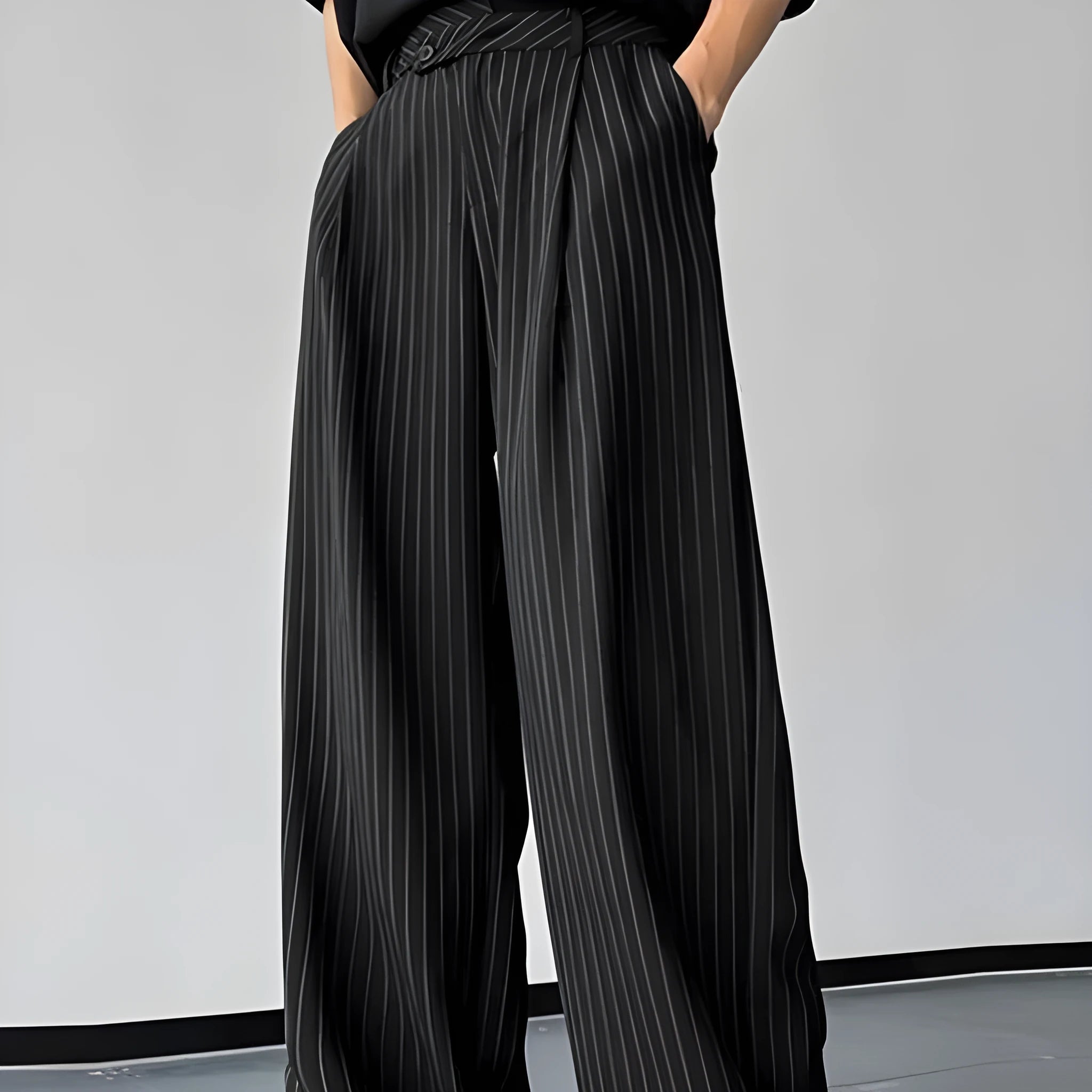 Black men's trousers with vertical stripes and pleated front design on elastic fabric