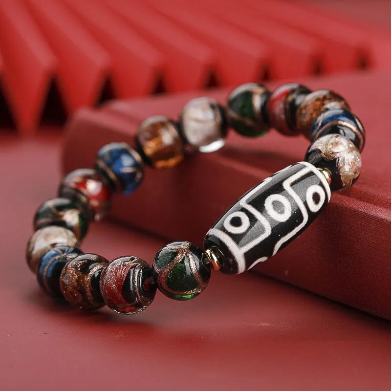 Snake year lucky bracelet with multicoloured glazed beads in Chinese auspicious patterns.
