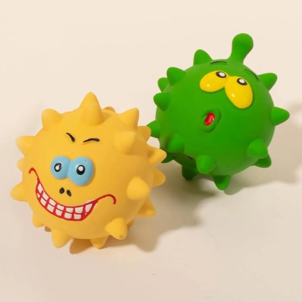 Set of four colourful natural latex squeaky dog balls with cute faces on a blue, green, red, and yellow background