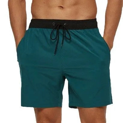 Men's blue running shorts with a drawstring waist and a zippered side pocket.
