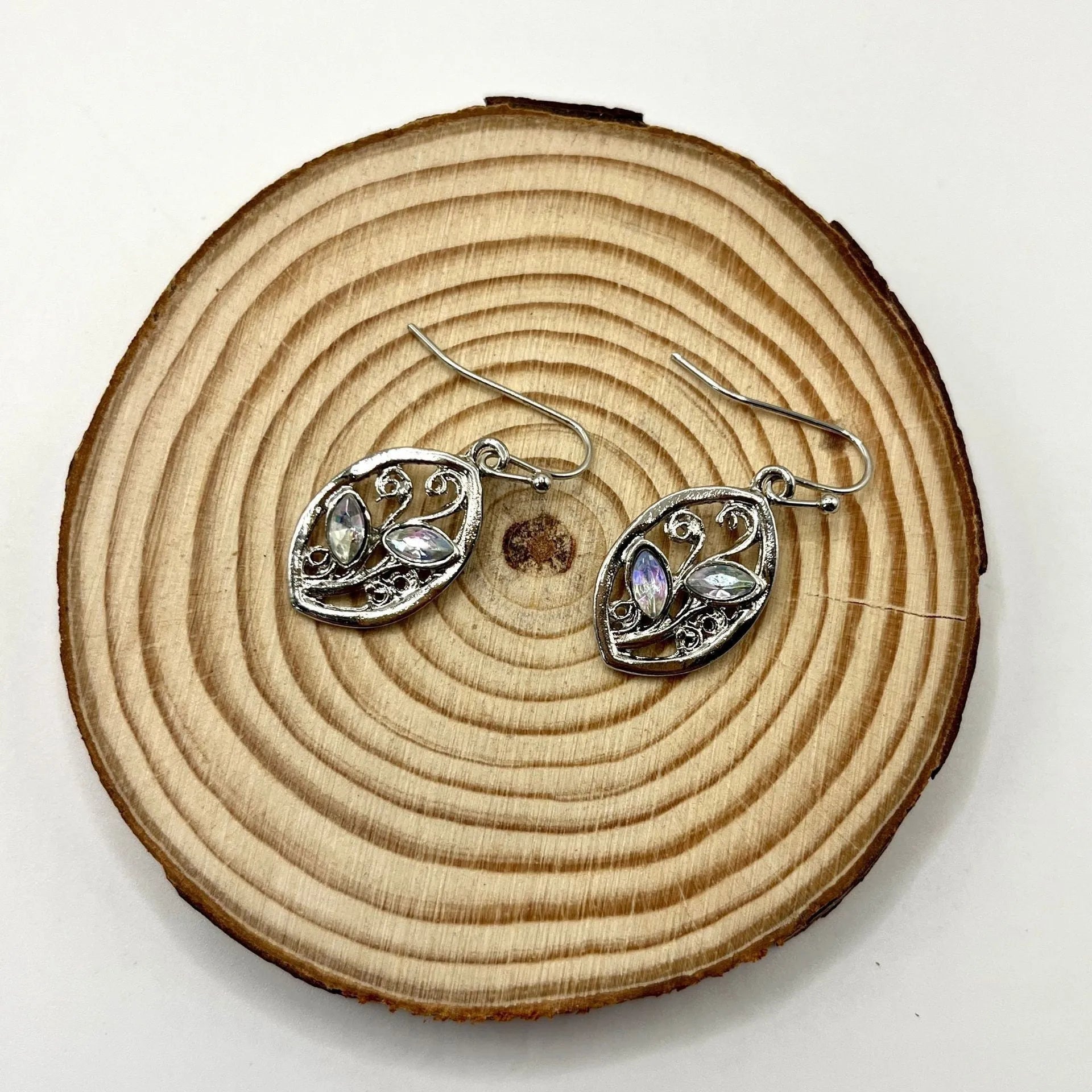 Silver leaf-shaped earrings with embedded colourful moonstone stones, European design