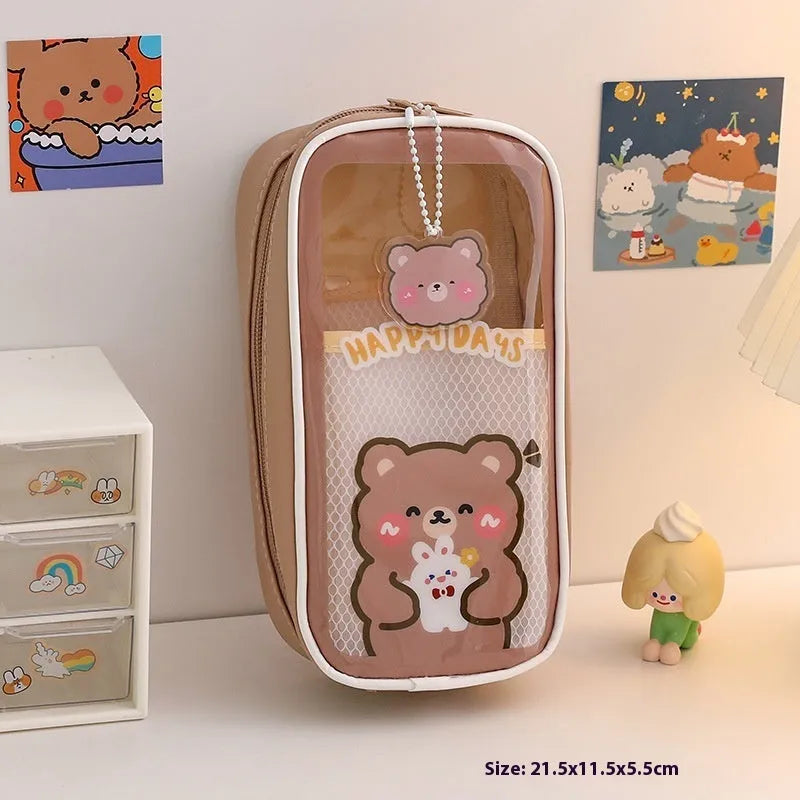 Transparent PVC pencil case with cartoon designs measuring 22cm length for school stationery organisation