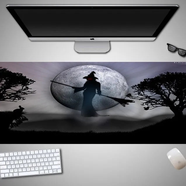 Halloween-themed oversized mouse pad with non-slip rubber cloth backing on a desk