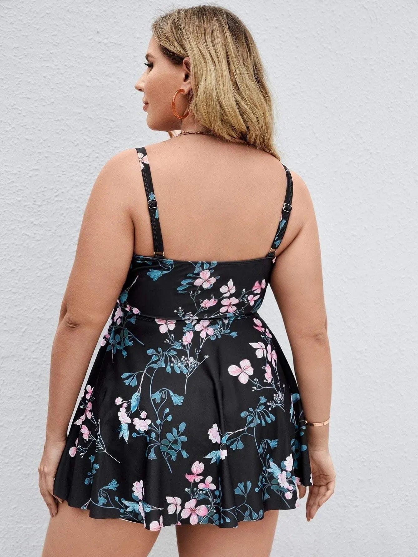 Women's floral print one-piece swimsuit with split colour design showing high elasticity fabric