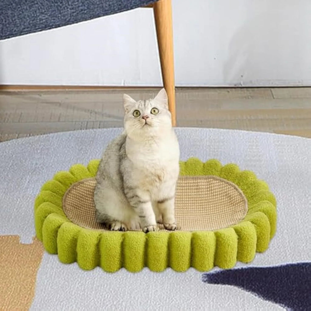 Green oval-shaped cat scratch pad and lounge bed made from textured sisal fabric.