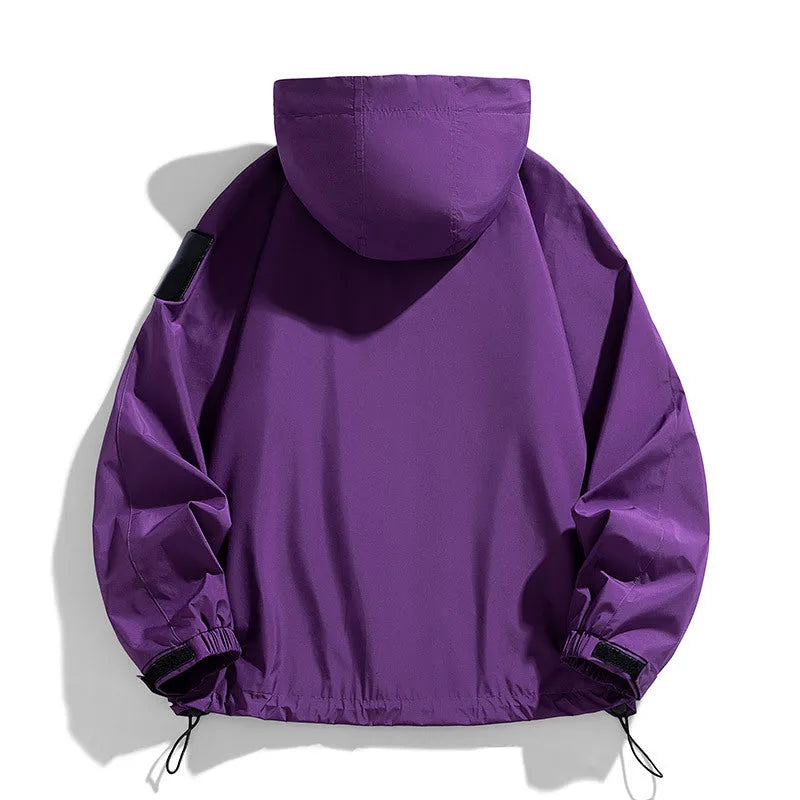 A man wearing a black windproof waterproof hooded jacket made from polyester blend fabric.