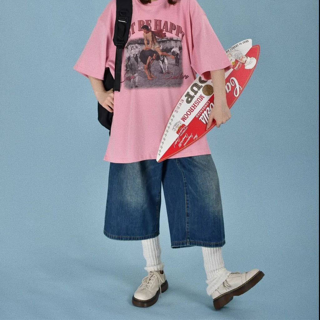 Men's loose-fit straight-leg denim shorts in blue, shown on a hanger.