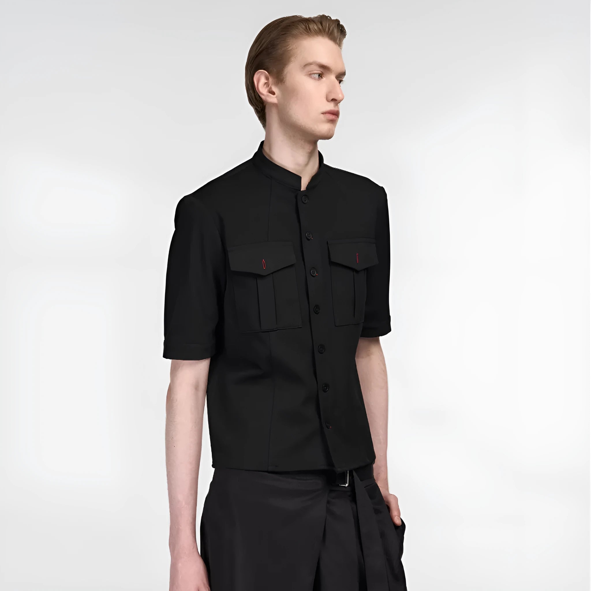 Black handmade half-sleeve hunting shirt with a shirt collar and loose fit on a mannequin.