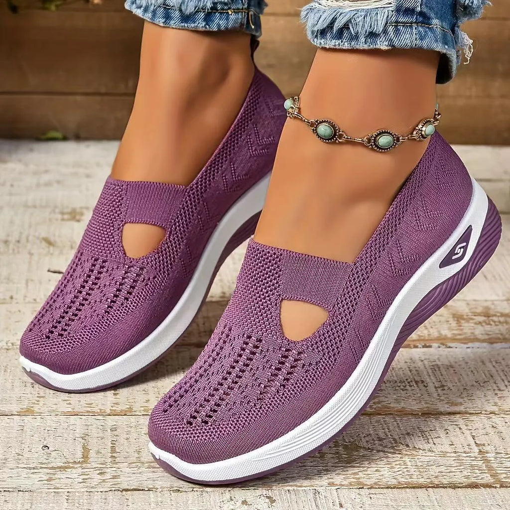 Soft-bottom casual mesh shoes with T-strap in multiple colours on a flat heel and round toe.