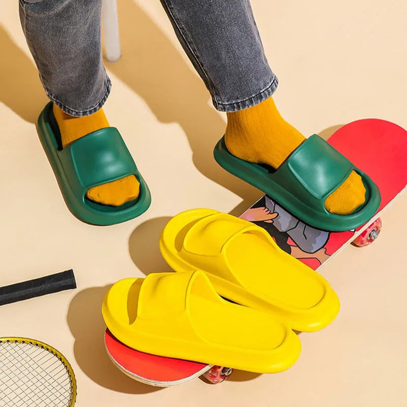 Thick-soled EVA foam flip-flop slippers for men and women in assorted colours on a white background.