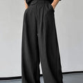 Black men's trousers with vertical stripes and pleated front design on elastic fabric