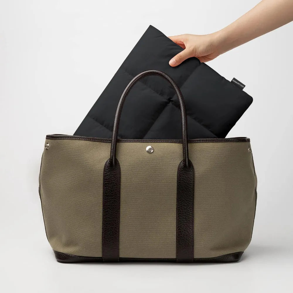 Soft fluffy laptop sleeve in black or khaki with retro sewing thread details, sized for 13 to 15.6 inch laptops