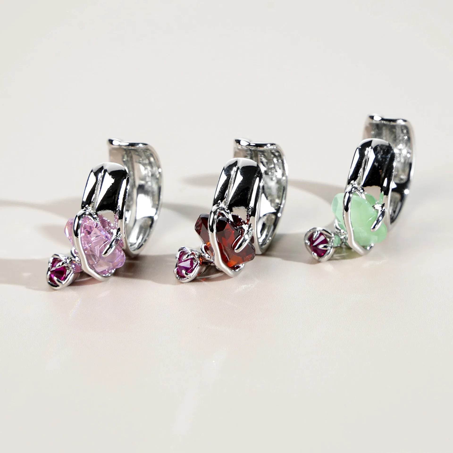 Peach blossom crystal clip-on earrings with platinum-plated copper base and gold-plated inlay in opal colour