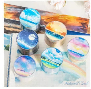 Roll of Japanese paper decorative washi tape with sky theme designs, showing colourful clouds, sunny day, and twilight patterns.