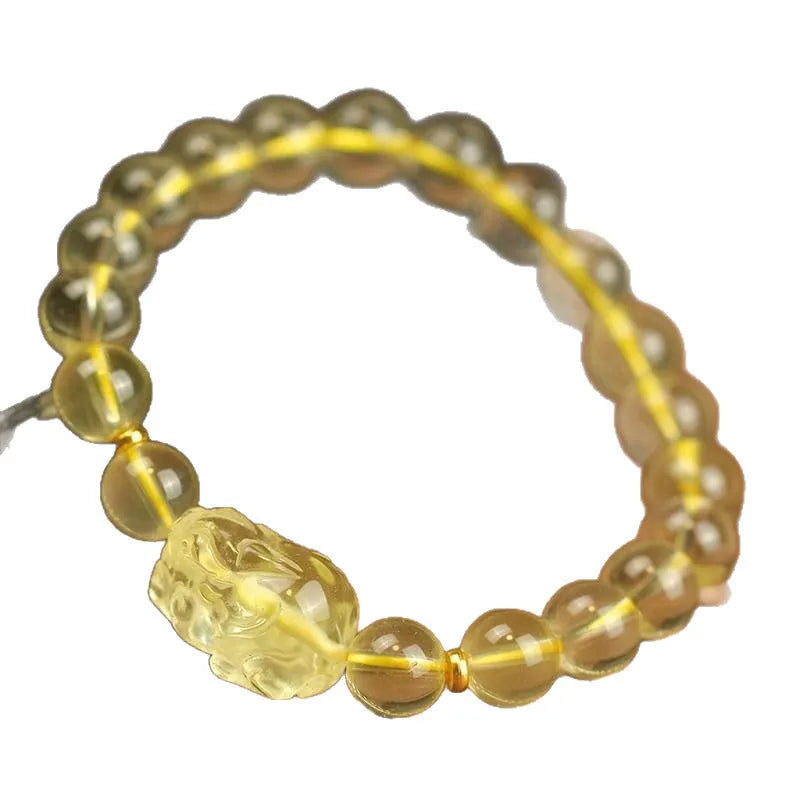 Yellow Pi Xiu bracelet with artificial crystal on leather strap in Chinese folk style design