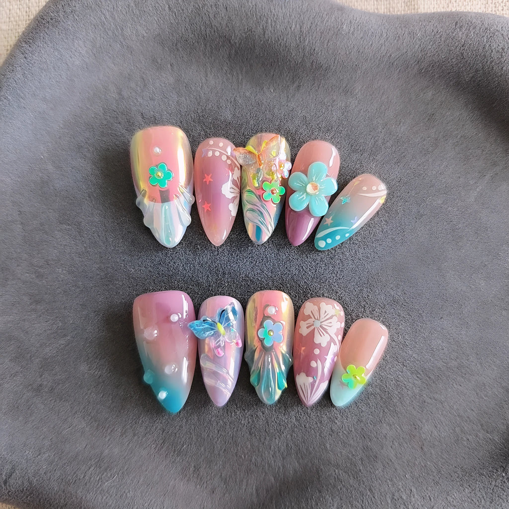 Handmade nail art sculptures with colourful embossed flower and butterfly designs