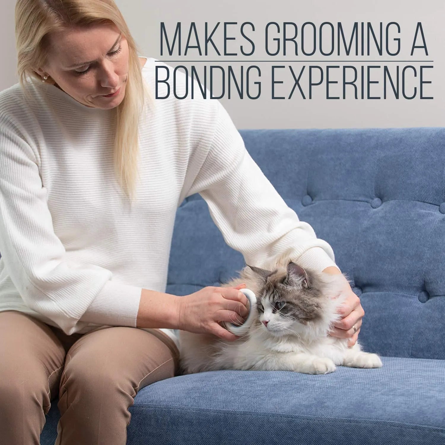 Blue plastic pet grooming comb with soft teeth and an ergonomic handle on a white background.