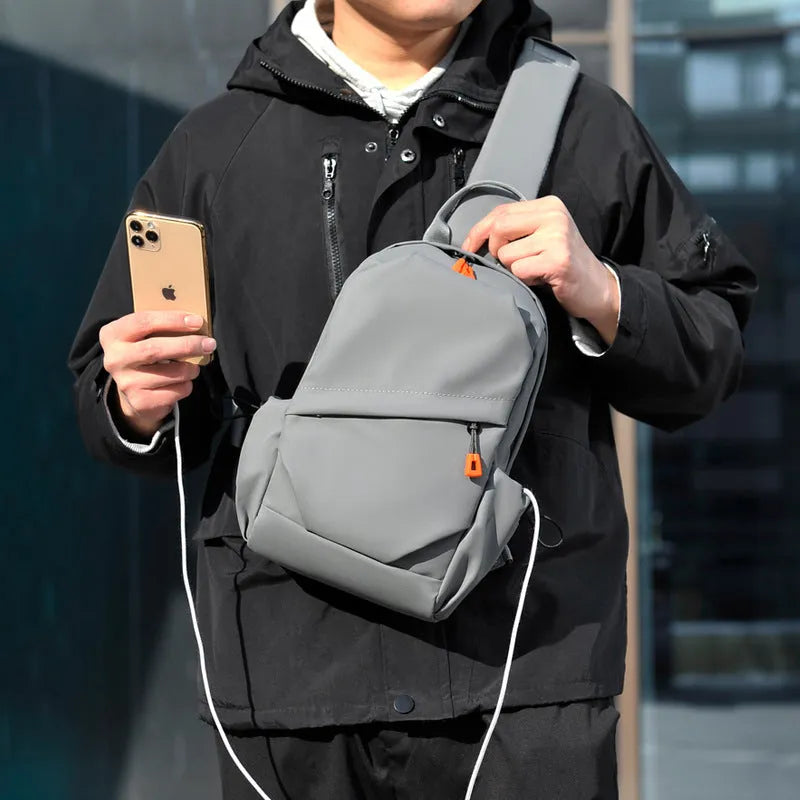 Men's black waterproof polyester crossbody bag with adjustable shoulder strap