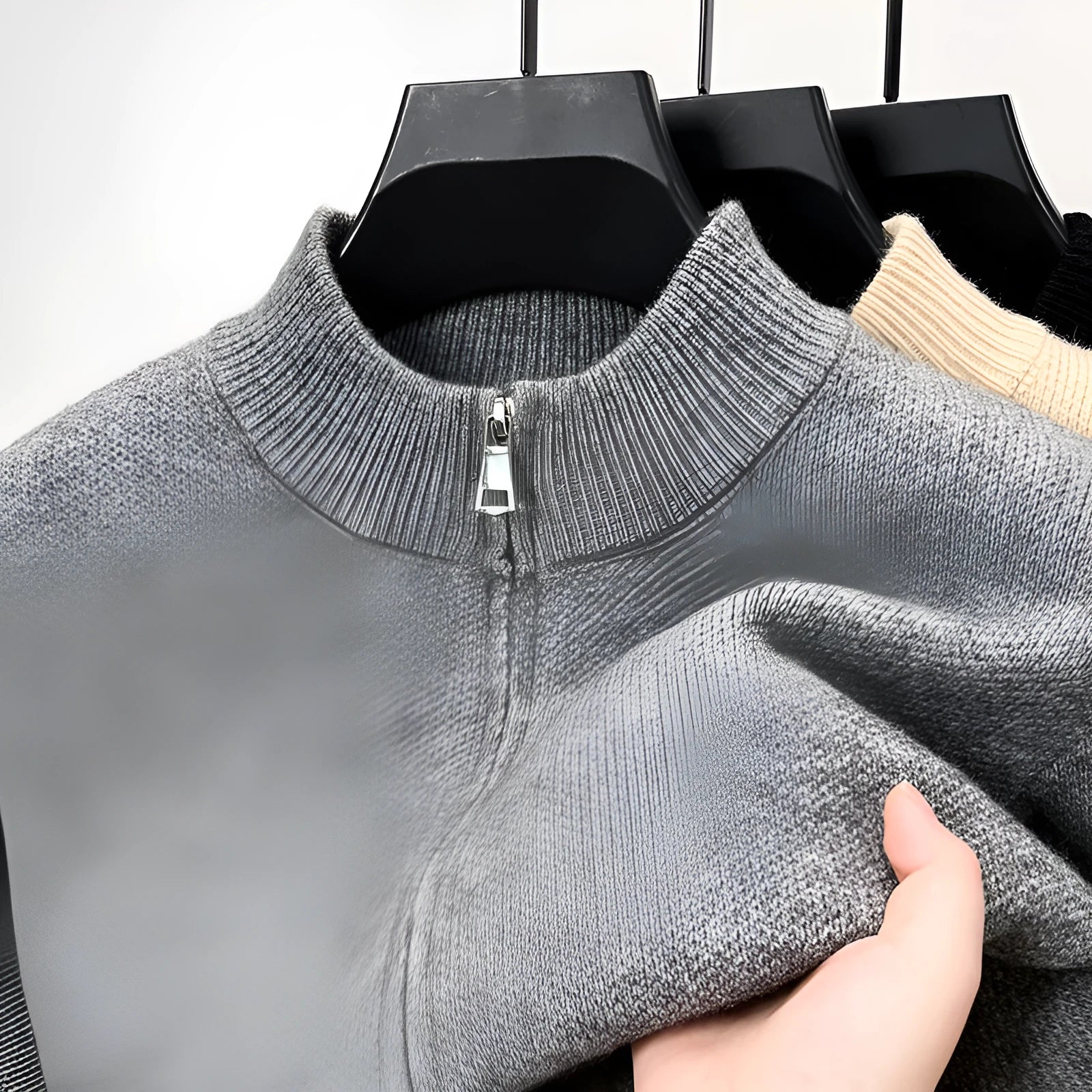 Men's grey stand collar knitted zip cardigan with a loose, thickened fit on a hanger.