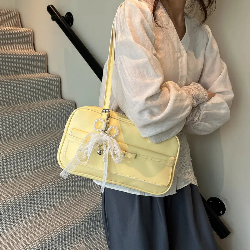 Women's single-shoulder flap bag in horizontal square shape with bow decoration and mobile phone compartment
