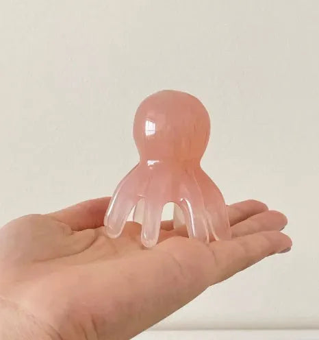 Pink octopus-shaped natural resin massage comb for periocular meridian treatment