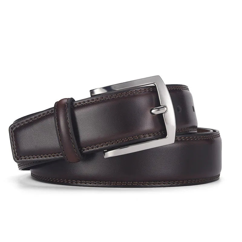 Men's black genuine leather belt with a silver alloy pin buckle fastened, showing glossy patent leather finish.