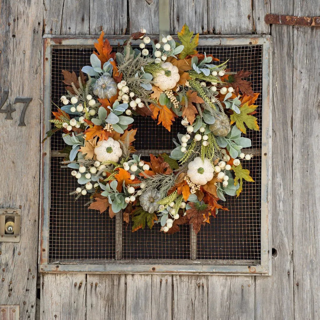 Pumpkin wreath with simulated frost leaves and pumpkins on a rattan ring base, 45x45cm size