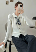 Women's beige cardigan sweater with a built-in lapel scarf collar and long sleeves.