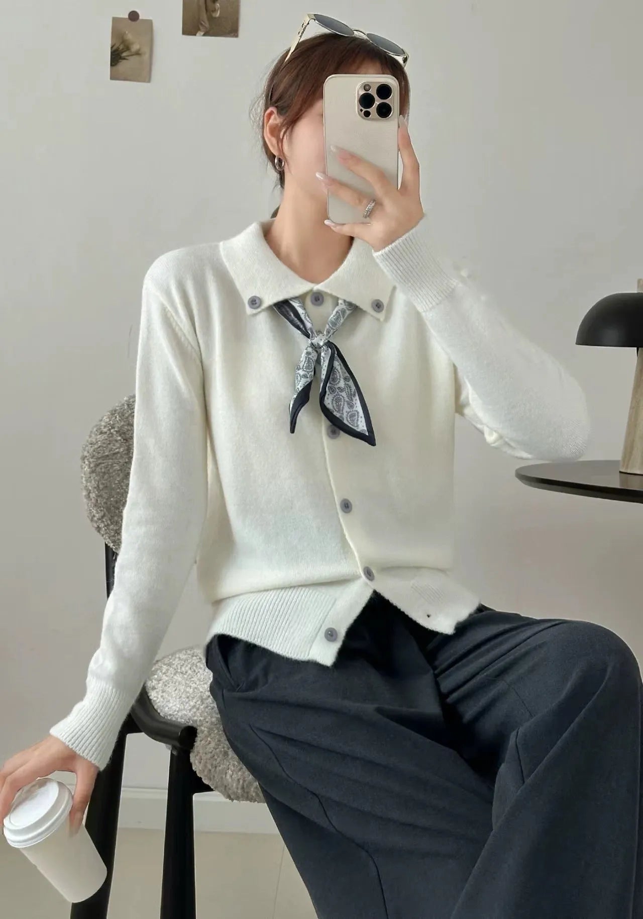 Women's beige cardigan sweater with a built-in lapel scarf collar and long sleeves.